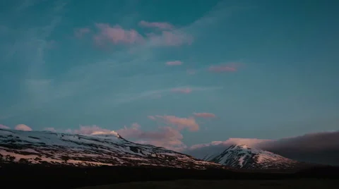 Sunset clouds above snow covered mountain Iceland Landscape 4K Timelapse Stock Footage 56571512