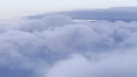 Sunset clouds aerial shot, gliding on descent through the atmosphere. Abstract Stock Footage 306576978