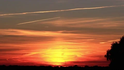 Sunset clouds with airplane contrail Stock Footage 180426463