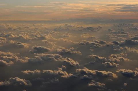 Sunset clouds from airplane Stock Photos