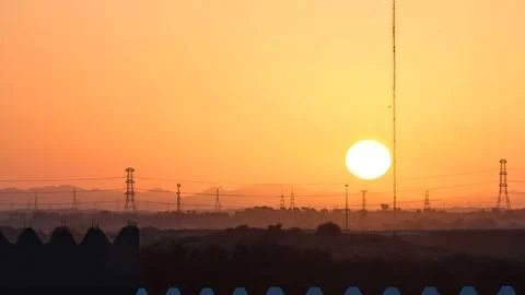 Sunset with clouds in Ajman cityscape from rooftop timelapse. Ajman is the ca Stock Photos