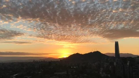 Sunset clouds and cityscape Stock Photos