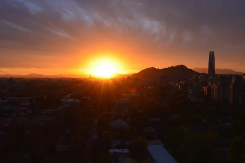 Sunset clouds and cityscape Stock Photos