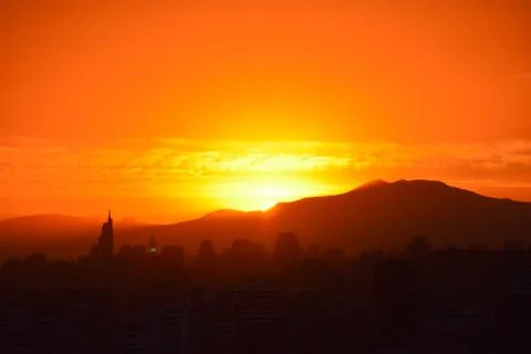 Sunset clouds and cityscape Stock-Fotos