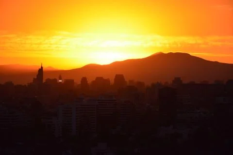 Sunset clouds and cityscape Stock Photos