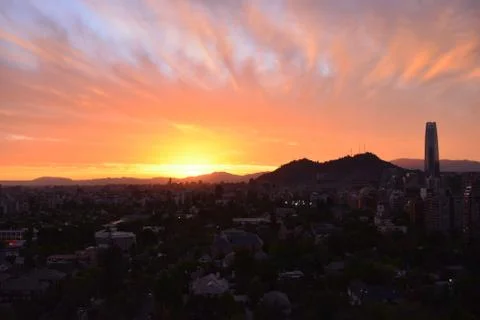 Sunset clouds and cityscape Stock Photos