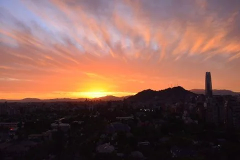 Sunset clouds and cityscape Stock Photos