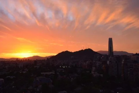 Sunset clouds and cityscape Stock Photos