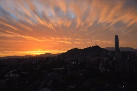 Sunset clouds and cityscape 库存照片