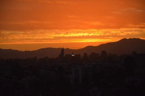 Sunset clouds and cityscape Stock Photos