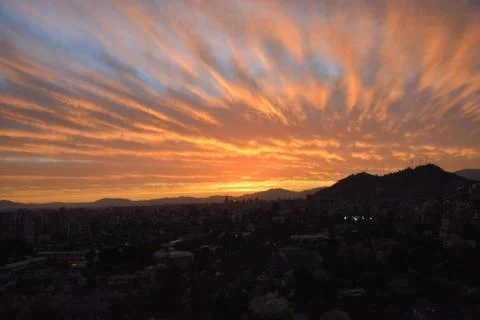 Sunset clouds and cityscape Stock Photos