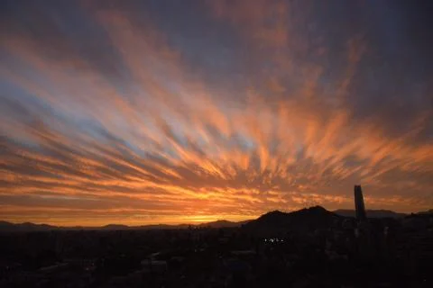 Sunset clouds and cityscape Stock Photos
