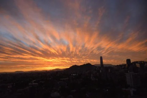 Sunset clouds and cityscape 库存照片
