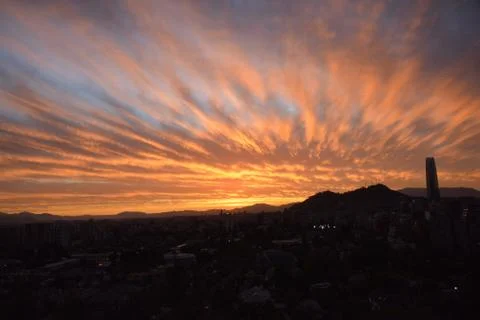 Sunset clouds and cityscape Stock Photos