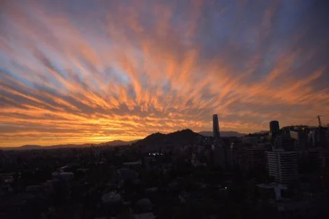 Sunset clouds and cityscape 库存照片