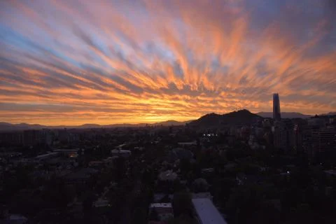 Sunset clouds and cityscape Stock Photos