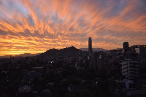 Sunset clouds and cityscape Stock Photos