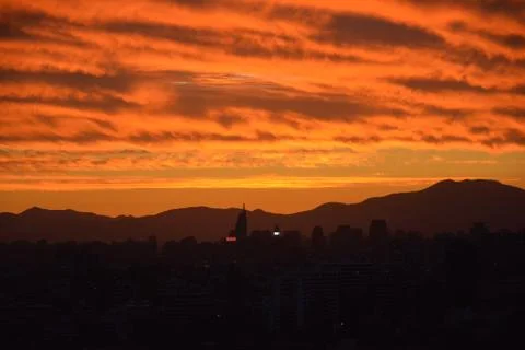 Sunset clouds and cityscape Stock Photos