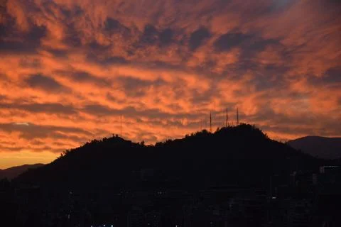 Sunset clouds and cityscape Stock Photos