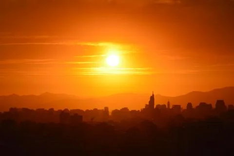 Sunset clouds and landscape Stock Photos