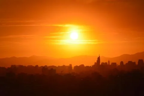 Sunset clouds and landscape Stock Photos