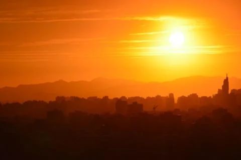 Sunset clouds and landscape Stock Photos