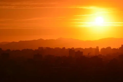 Sunset clouds and landscape Stock Photos