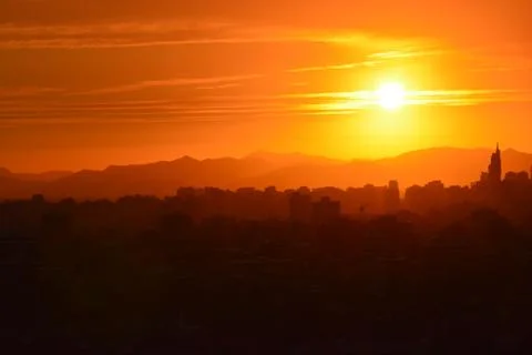 Sunset clouds and landscape 库存照片