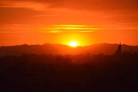 Sunset clouds and landscape Stock Photos