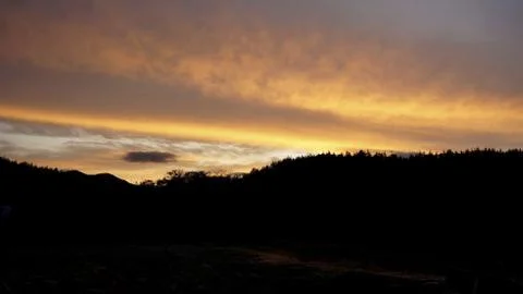 Sunset clouds and mountains Stock Photos