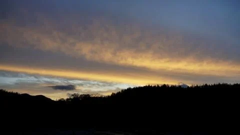 Sunset clouds and mountains Stock Photos