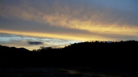 Sunset clouds and mountains Stock Photos