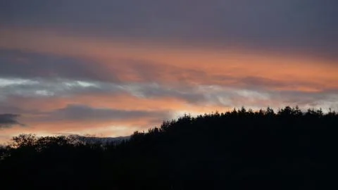 Sunset clouds and mountains Stock Photos