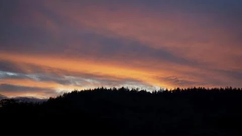 Sunset clouds and mountains Stock Photos