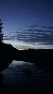 Sunset clouds and mountains Stock Photos