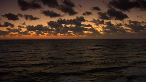Sunset. Clouds and ocean waves view from balcony. pan Stock Footage 102532277