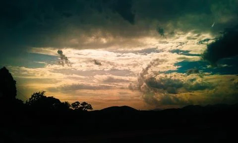Sunset with clouds in the background Stock Photos
