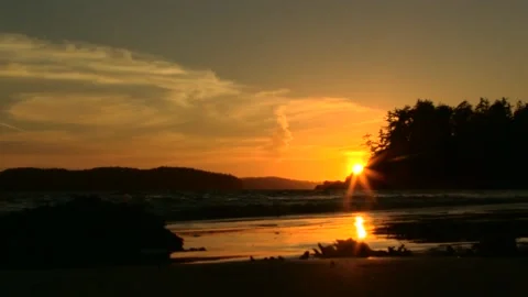 Sunset with clouds behind an island Stock Footage 202110411