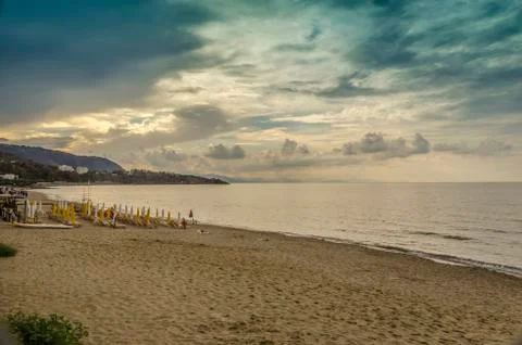 Sunset with clouds in Cefalu beach Stock Photos