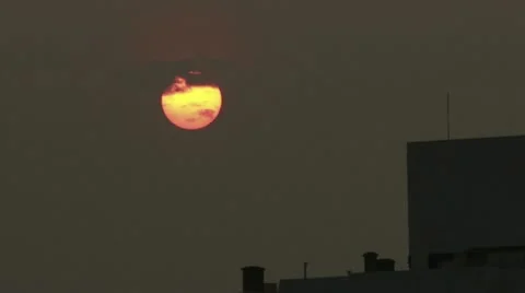 Sunset into clouds close up over building Timelapse 스톡 동영상 12344456
