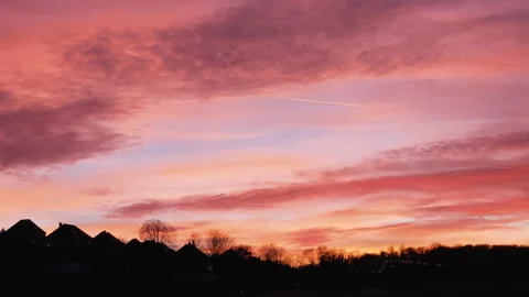 Sunset clouds in colorful sky, time lapse. Orange lilac pink colored sky Stock Footage 263562995
