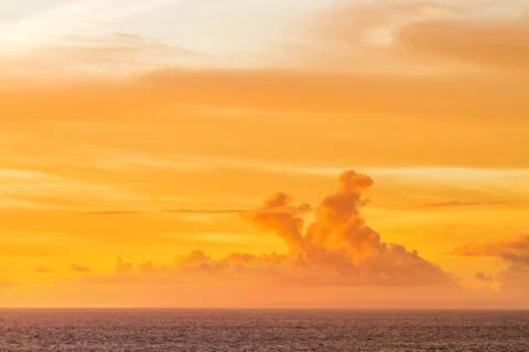 Sunset with clouds of different shapes. Bali, Indonesia, Indian ocean. Stock Photos
