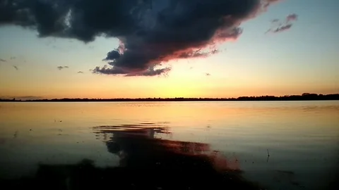 Sunset with clouds on Draycote water - UK Stock Footage