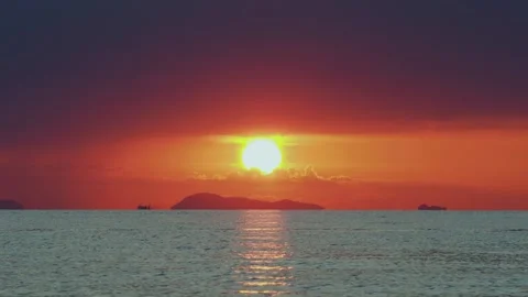 Sunset clouds during tropical sunset over island. Stock Footage 331836081