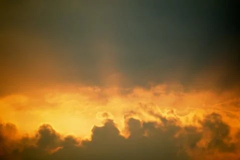 Sunset with clouds on golden sky Foto stock