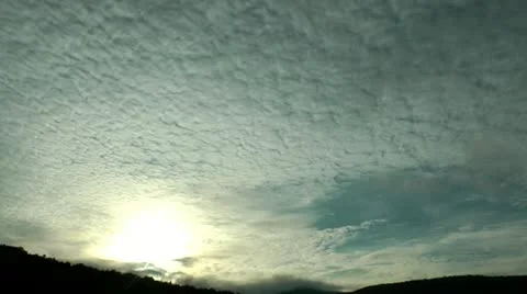 Sunset, clouds have structure of dense pieces of cotton wool Видео 12327806