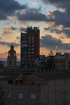 Sunset clouds over the evening city 스톡 사진