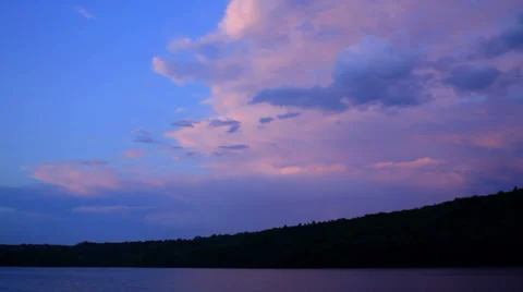 Sunset clouds over lake Stock Footage 28611396