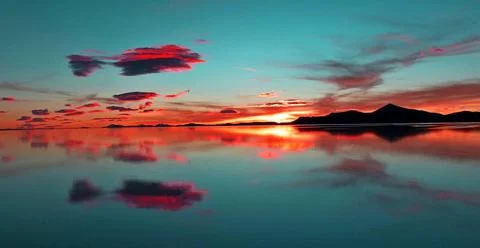 Sunset clouds over lake. Stock-Fotos