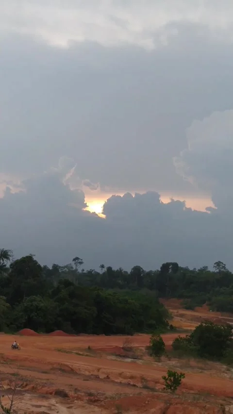 Sunset clouds over landscape Stock Footage 336045734